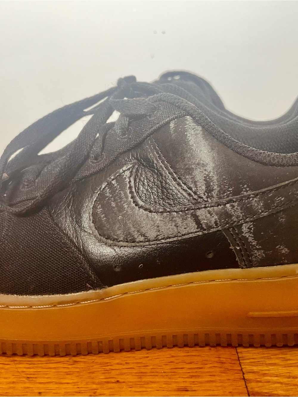 Custom Nike Air Force 1s Low / black-on-black, gum sole Women’s 7.5